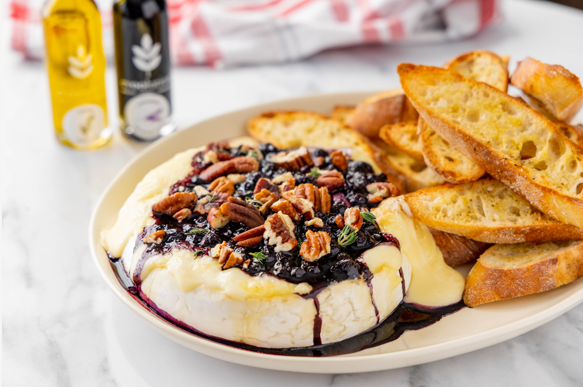 Baked Brie with Blueberry Lavender Balsamic Compote and Thyme Olive Oi ...